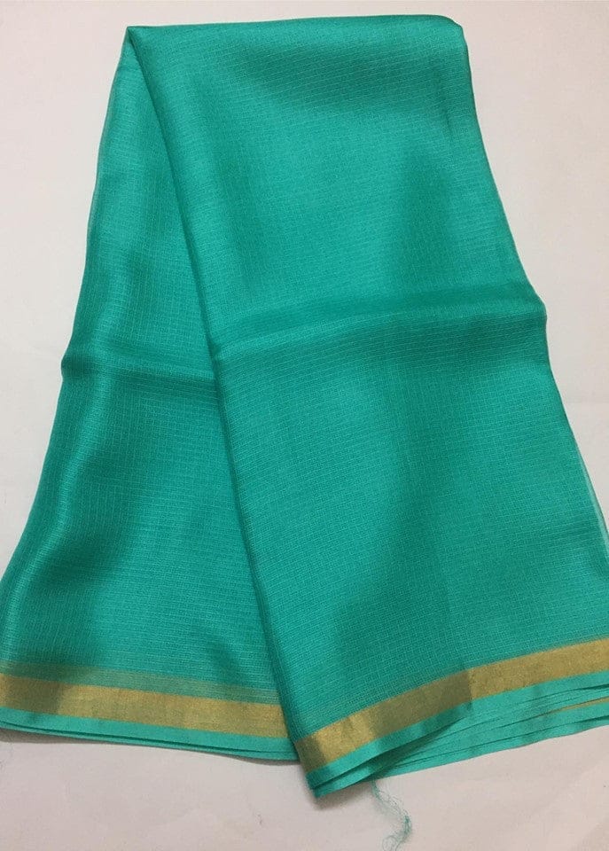 Kota Doria Silk Saree is on the floor