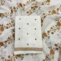 White Embroidered Salwar Kameez on the floor