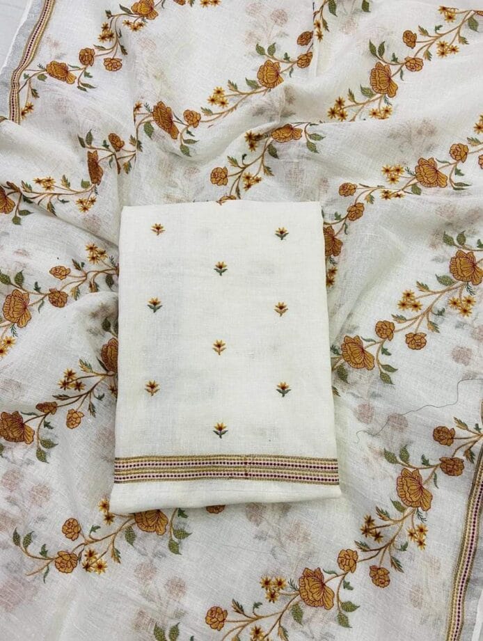 White Embroidered Salwar Kameez on the floor