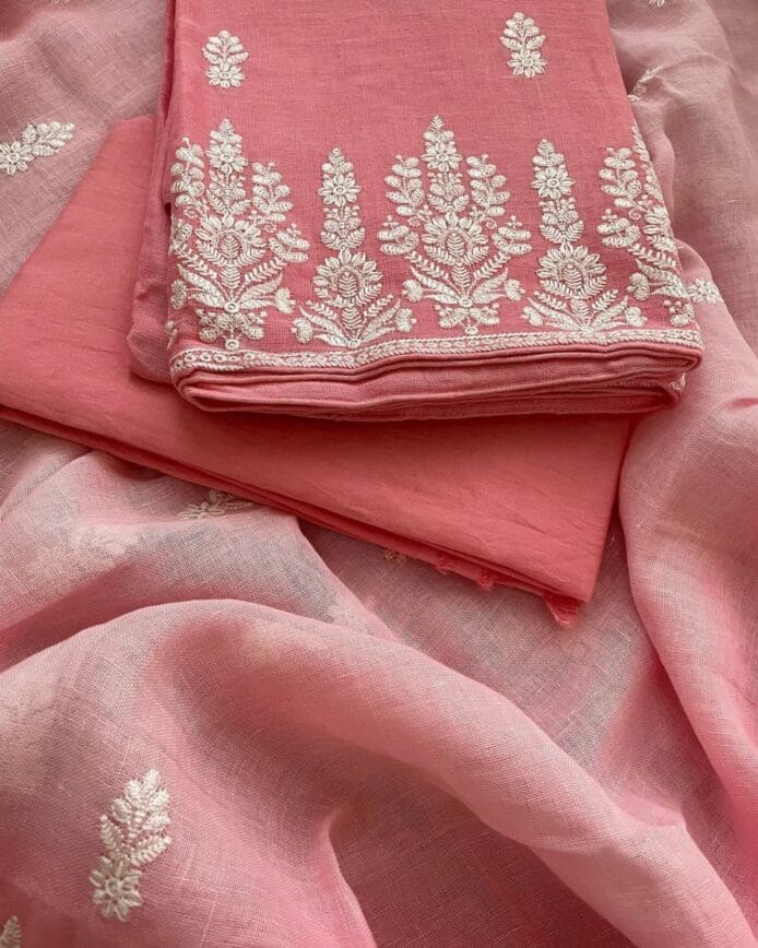 Linen Embroidery on Salwar Suits on floor with plant pot