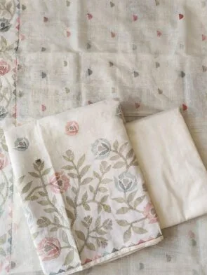 Off White Linen Heavy Embroidery Suits on the floor shoot