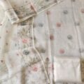 Off White Linen Heavy Embroidery Suits on the floor shoot