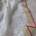 Onam sarees for women on the floor