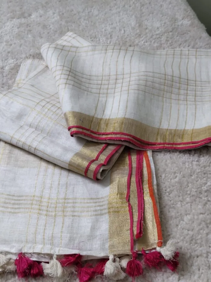 Onam sarees for women on the floor