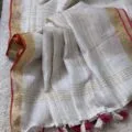 Onam sarees for women on the floor