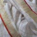 Onam sarees for women on the floor