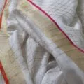 Onam sarees for women on the floor