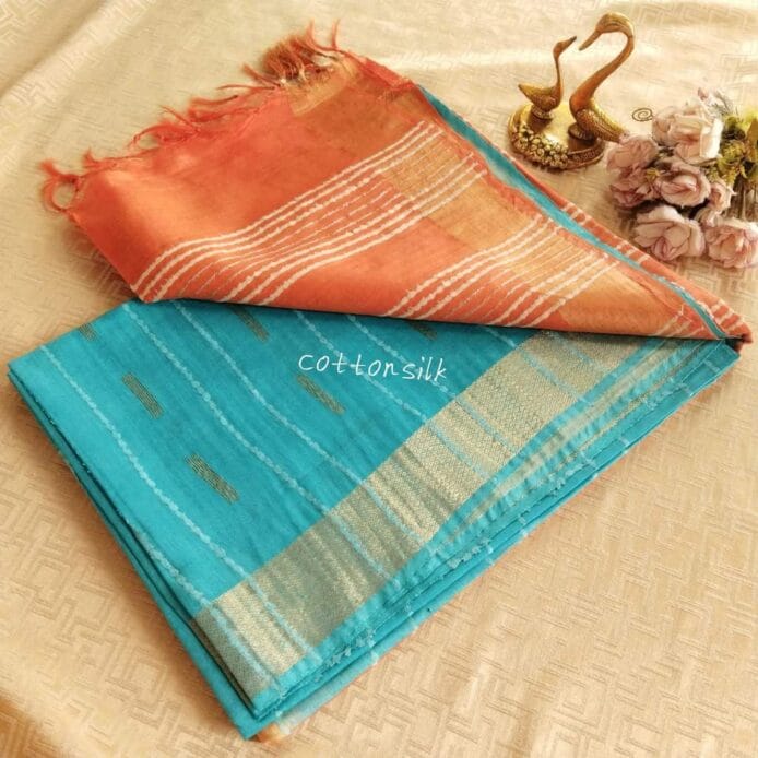 Stylish Semi Silk Sarees on the floor with pot