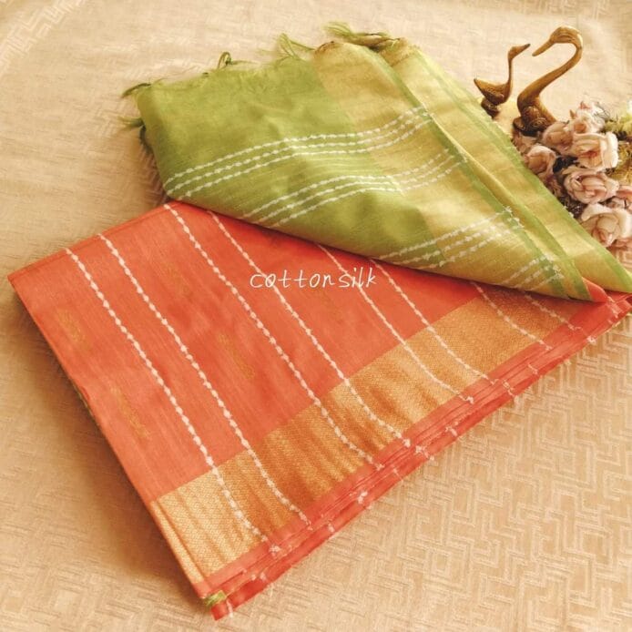 Stylish Semi Silk Sarees on the floor with pot