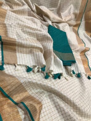Fabric: 50% Linen and 50% Cotton Quality: Premium Saree Colour: Off-white Pattern: Weaving Zari Check Saree Length: 5.5 meters Blouse Length: 1 meter (Unstitched) Wash Care: 1. Kindly hand wash it separately. 2. No machine wash. Avoid direct sunlight: It's best to store them in a cool, dry place away from sunlight. Disclaimer: Actual colours may vary. This is because every monitor/screen can display colours differently. We try to edit our photos to show the samples as life-like as possible, but please understand the actual colour may vary slightly from your monitor. We cannot guarantee that the colour you see portrays the product's true colour.