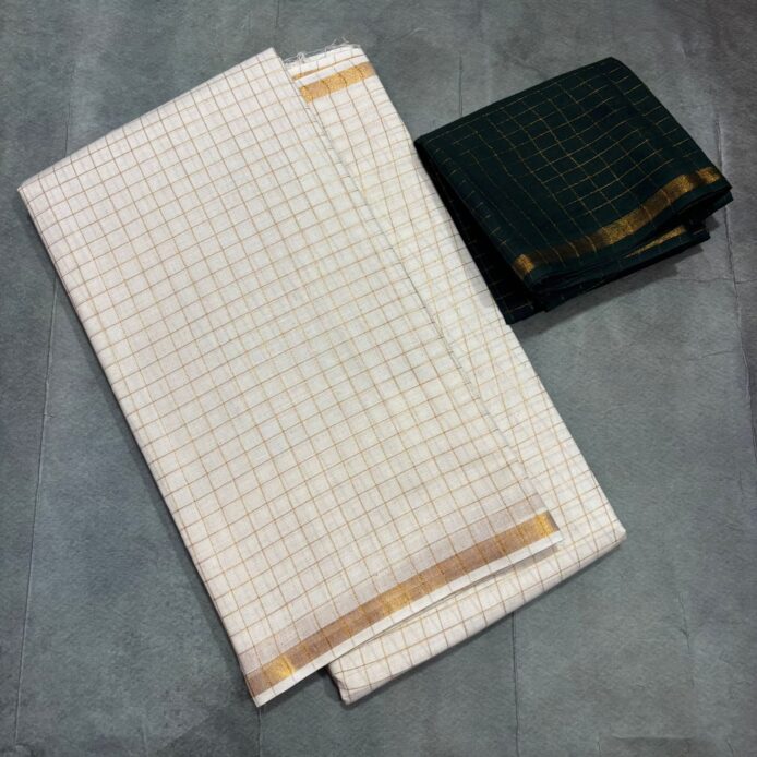White Onam Saree with contrast blouse featuring copper zari border and zari checks by Aamir Fashion Textile.