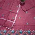 Cotton Embroidered Salwar Suit Material on floor with Flower pot