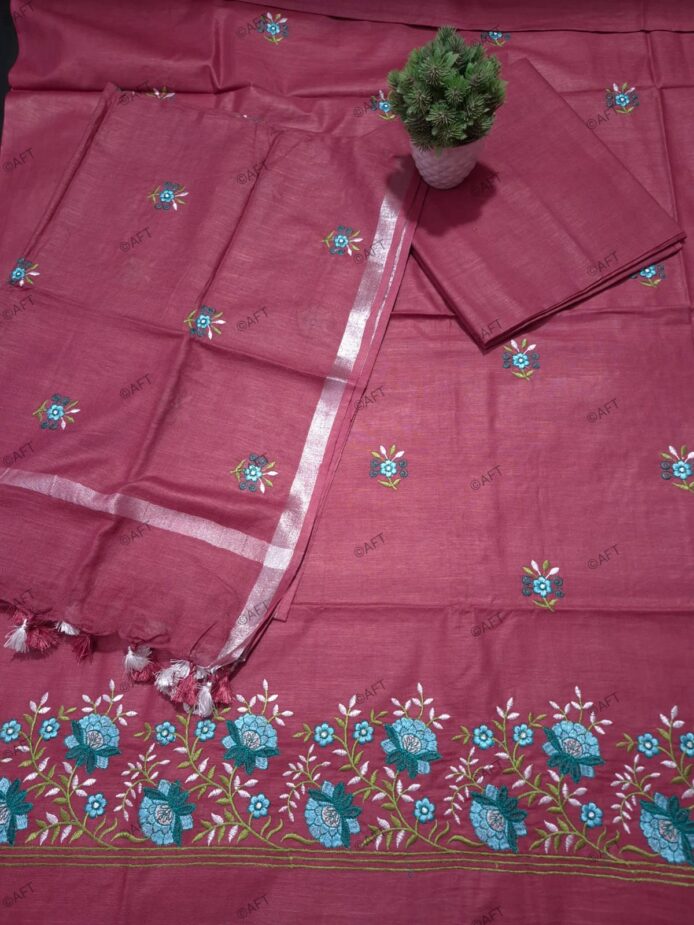 Cotton Embroidered Salwar Suit Material on floor with Flower pot