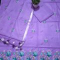 Unstitched Cotton Salwar Suit with Dupatta on the floor with flower pot