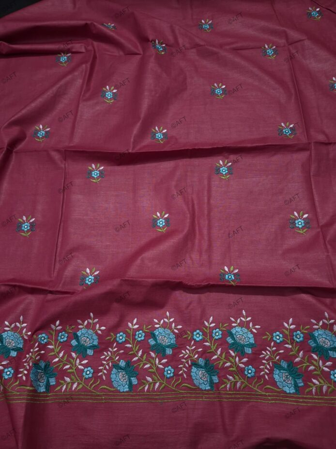 Cotton Embroidered Salwar Suit Material on floor with Flower pot