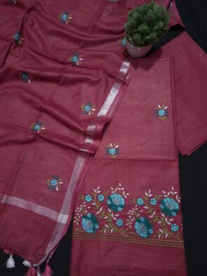 Cotton Embroidered Salwar Suit Material on floor with Flower pot