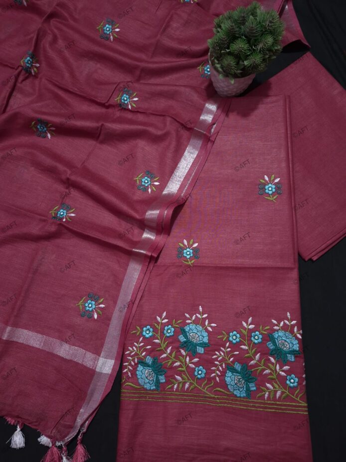 Cotton Embroidered Salwar Suit Material on floor with Flower pot