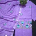Unstitched Cotton Salwar Suit with Dupatta on the floor with flower pot