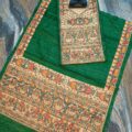 Tussar Ghicha Silk Madhubani Painting Dress Material on the floor with Budhdha Toy