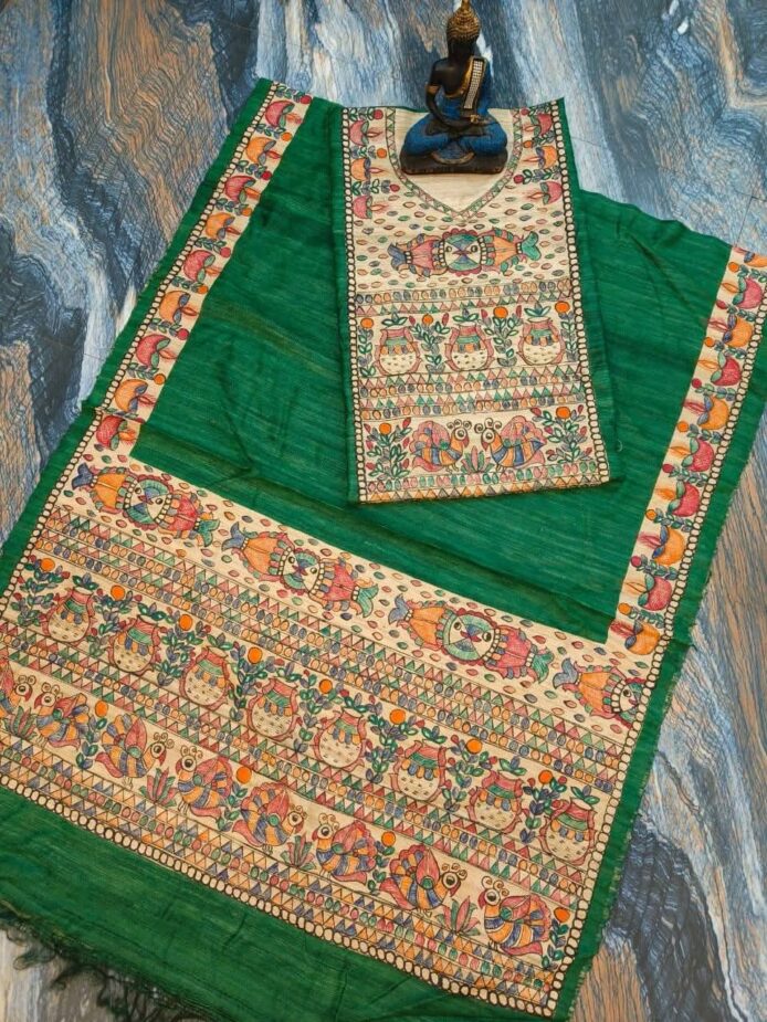 Tussar Ghicha Silk Madhubani Painting Dress Material on the floor with Budhdha Toy