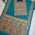 Tussar Ghicha Silk Madhubani Painting Dress Material on the floor with Budhdha Toy