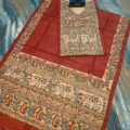 Tussar Ghicha Silk Madhubani Painting Dress Material on the floor with Budhdha Toy