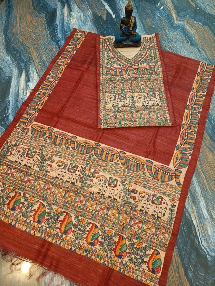 Tussar Ghicha Silk Madhubani Painting Dress Material on the floor with Budhdha Toy