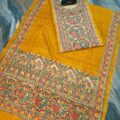 Tussar Ghicha Silk Madhubani Painting Dress Material on the floor with Budhdha Toy