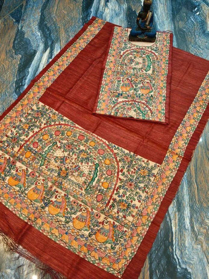 Tussar Ghicha Silk Madhubani Painting Dress Material on the floor with Budhdha Toy