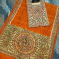 Tussar Ghicha Silk Madhubani Painting Dress Material on the floor with Budhdha Toy
