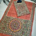 Tussar Ghicha Silk Madhubani Painting Dress Material on the floor with Budhdha Toy