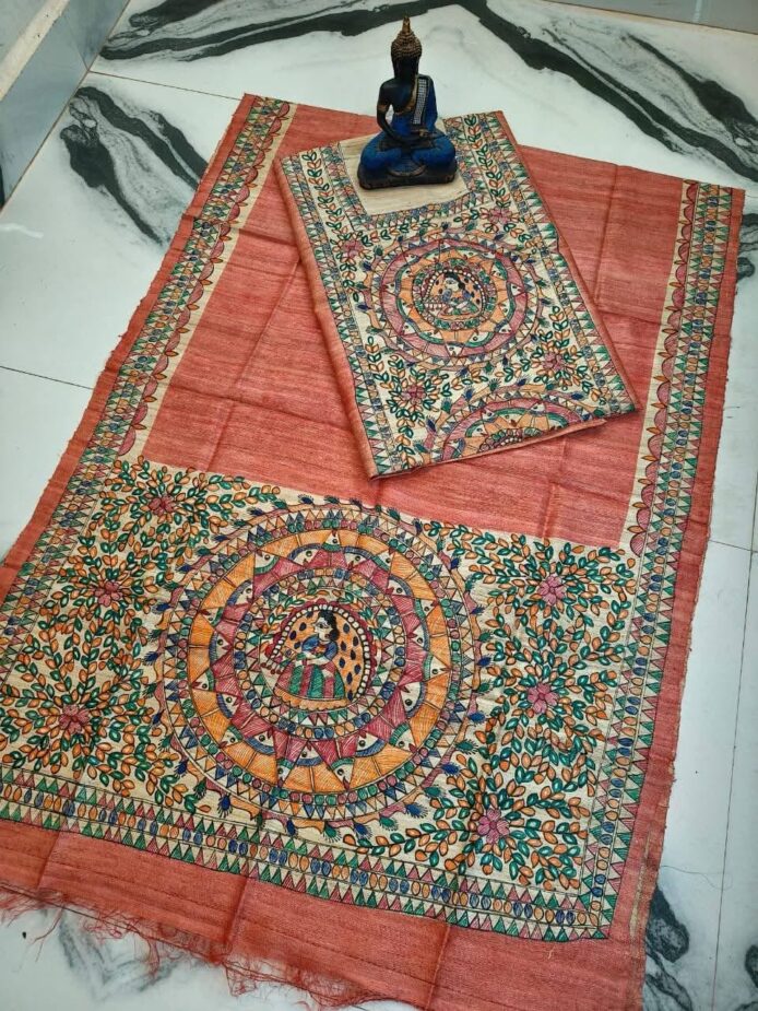 Tussar Ghicha Silk Madhubani Painting Dress Material on the floor with Budhdha Toy