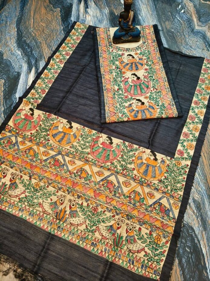 Tussar Ghicha Silk Madhubani Painting Dress Material on the floor with Budhdha Toy