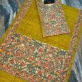 Tussar Ghicha Silk Madhubani Painting Dress Material on the floor with Budhdha Toy