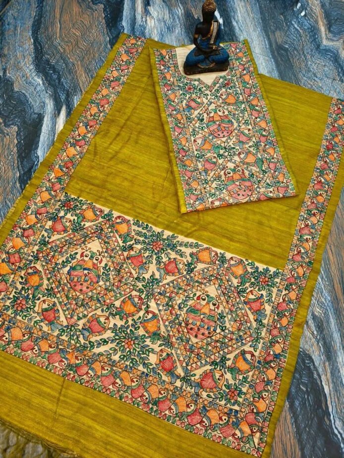 Tussar Ghicha Silk Madhubani Painting Dress Material on the floor with Budhdha Toy