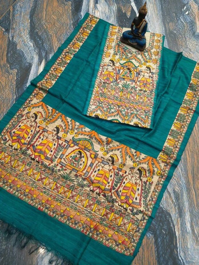 Tussar Ghicha Silk Madhubani Painting Dress Material on the floor with Budhdha Toy